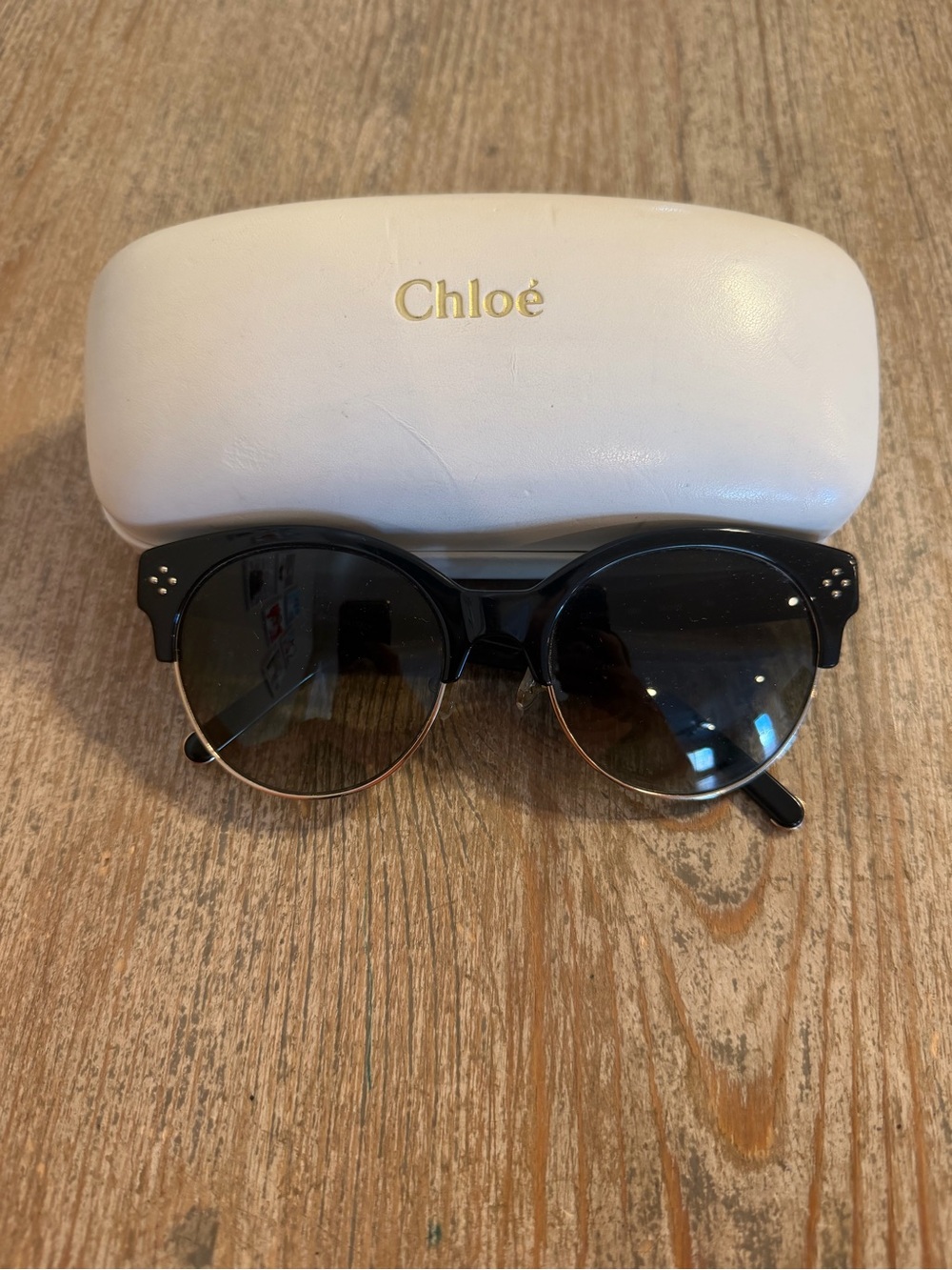 Chloé Black and Gold Round Sunglasses